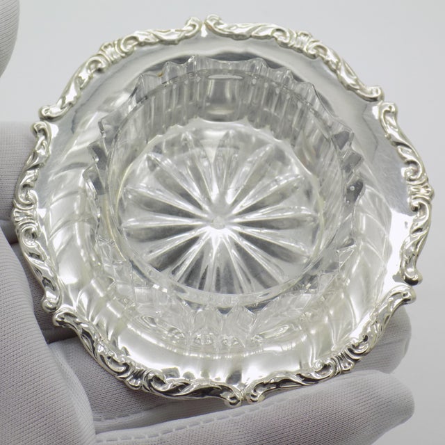 An elegant vintage salt cellar with glass, crafted in Italy between the 1970s and 1980s in authentic Continental Silver...