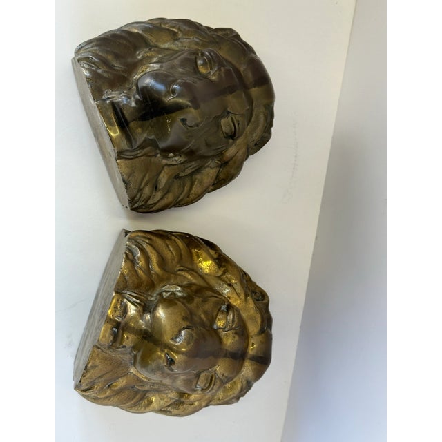 Pair of Vintage Hollywood Regency Brass Lion Head Bookends or Bookshelf Decor These vintage brass lion head bookends...