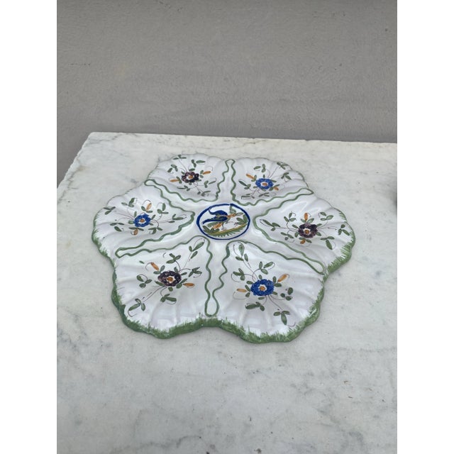 French faience oyster plate with Bird Moustiers style signed Martres Tolosane, circa 1940.