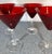 Set of four ruby red martini glasses with clear stem and foot. Great addition for anyone’s bar or as a housewarming gift.