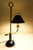 An elegant early 20th-century French-style bouillotte tole table lamp, featuring classic painted metal detailing and...