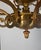 A Art Nouveau style brass 8 light chandelier. The chandelier is heavy and of fine quality. Wired for USA.