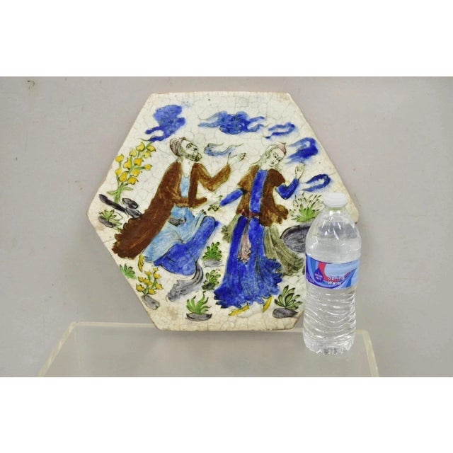 Antique Persian Iznik Qajar Style Ceramic Pottery Tile Hexagonal Blue Couple C5. Circa Early 20th Century. Measurements...