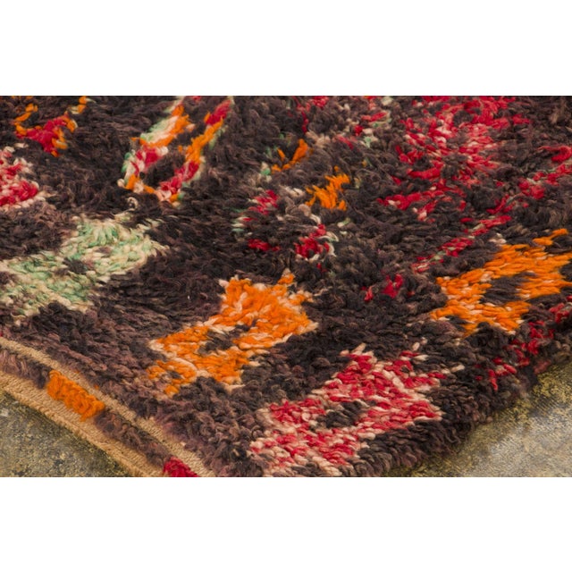 Hand-knotted in wool and originating circa 1950-1959, this 6x9 vintage Moroccan berber rug joins Rug & Kilim’s Moroccan...