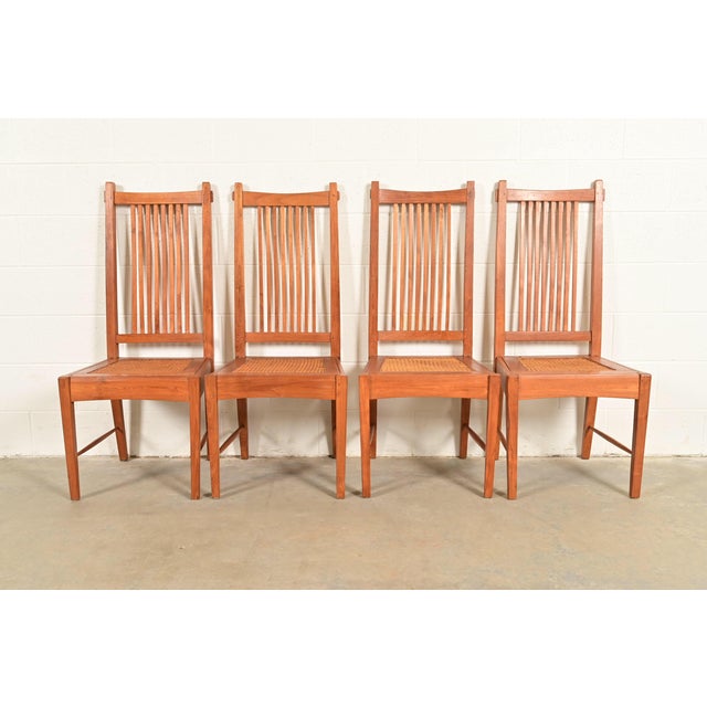 A gorgeous set of four Arts & Crafts or Mission style dining chairs In the manner of Stickley USA, Circa Mid-20th Century...