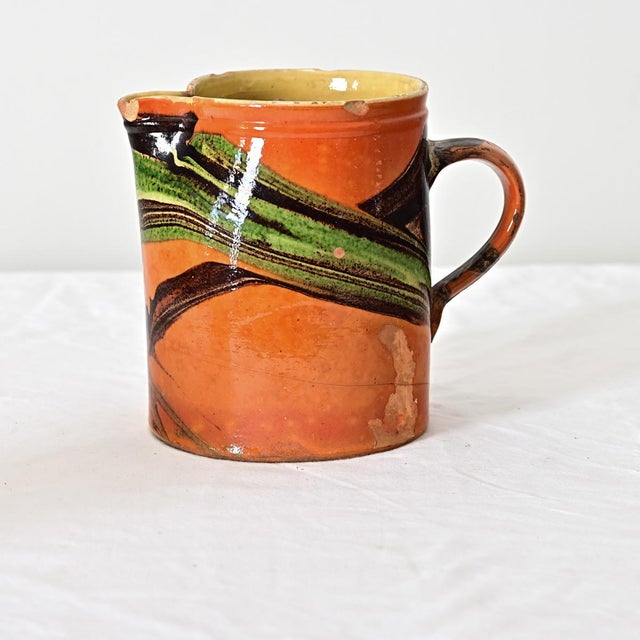 This 19th century French jaspé ware pitcher from the region of Savoie makes an exciting vase or stand alone decor item for...