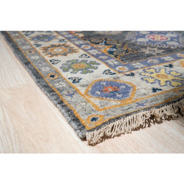Lila Ruby Charcoal Hand Knotted Wool Rug, Country of Origin: India. This exceptional hand-knotted piece showcases the...