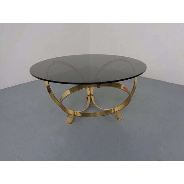 Space Age coffee table by Knut Hesterberg with a heavy, tinted glass top and gilded metal frame from the 1960s. I have...