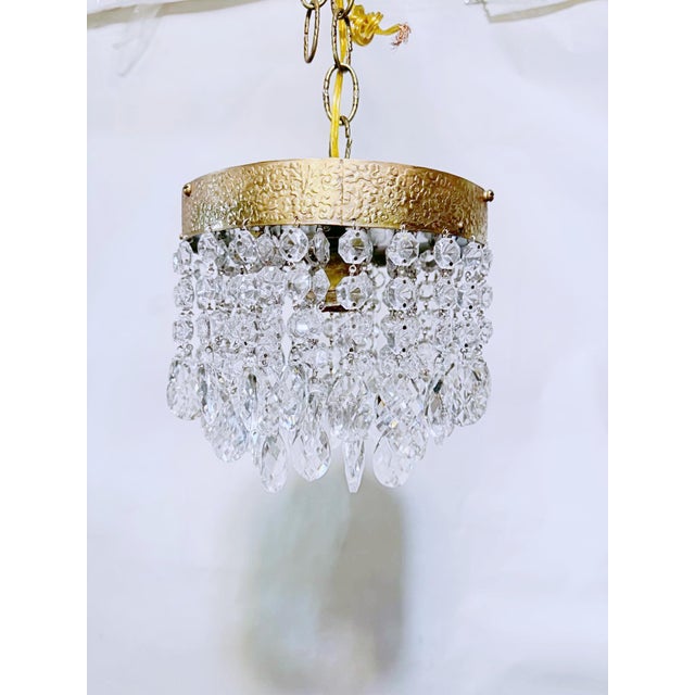A captivating blend of vintage charm and understated luxury, this elegant crystal chandelier brings a touch of old-world...