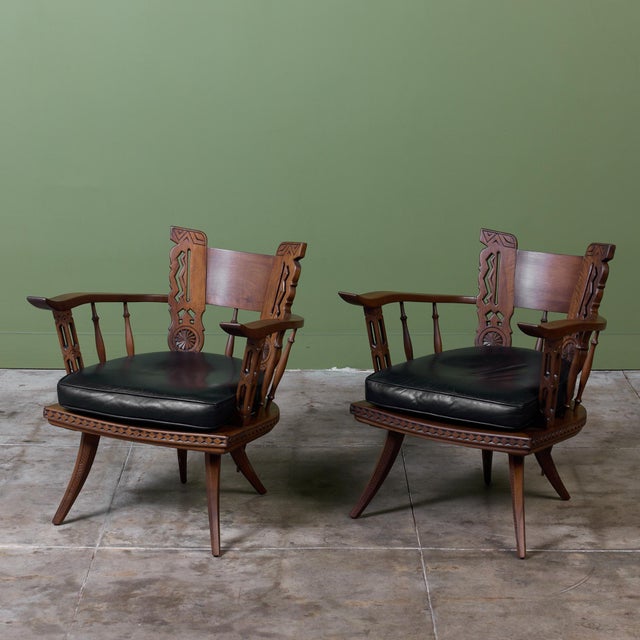 Pair of armchairs, designed in the style of renowned Italian wood carver Ettore Zaccari. Each chair is meticulously...