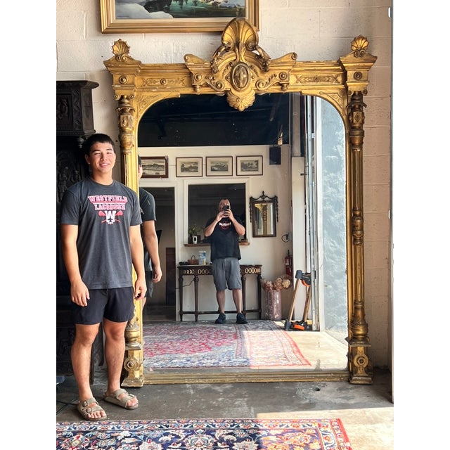 An exceptional monumental Victorian Renaissance Revival pier mirror dating to the late nineteenth century, this impressive...