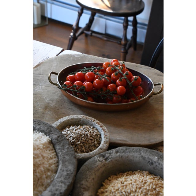 Originally used for grinding herbs and spices, this piece now serves as a striking decorative accent, perfect for holding...