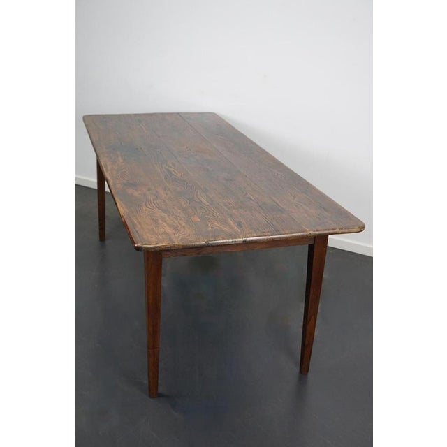 This French farmhouse table was made between 1840 and 1860 in France. It retained a very nice rich patina over the years...