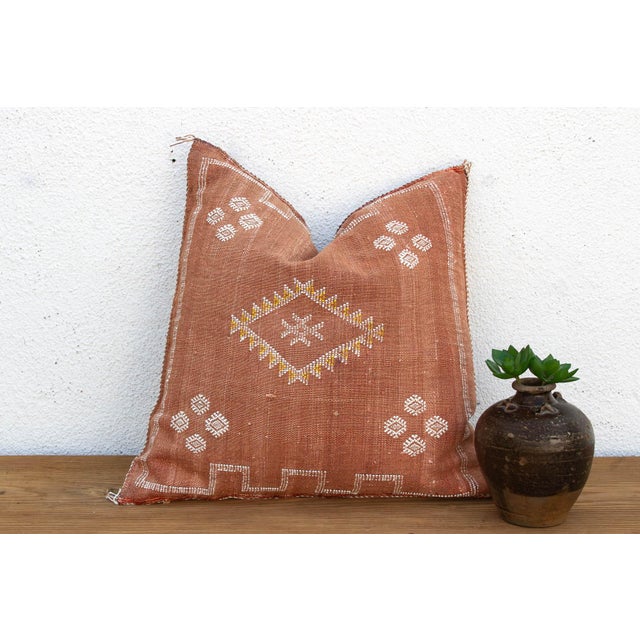 Woven from the resilient fibers of the Saharan aloe vera cactus — often called cactus silk or Sabra silk — this large...