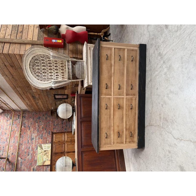This antique workshop cabinet, crafted from oak and pine, has been fully restored. It features a black patinated body and...