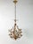 Chandelier from the 1950s in iron and painted with a natural vintage patina. It has six candle lights surrounded with...