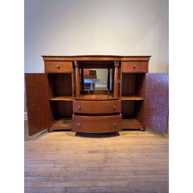 Stunning early 20th-century Arts and Crafts–style solid oak sideboard/buffet. Expertly crafted with solid construction and...