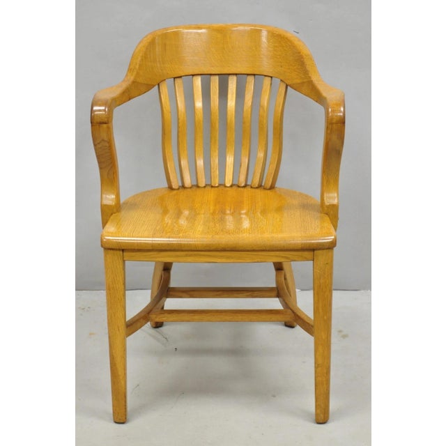 Traditional Antique Solid Golden Oak Wood Office Library Bankers Arm Chair. Circa Early 20th Century. Measurements: 32" H...