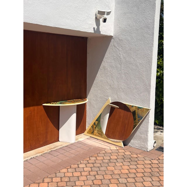 A striking and very unique matching set including a Demi-lune console and eye-shaped mirror with colorful postmodern...