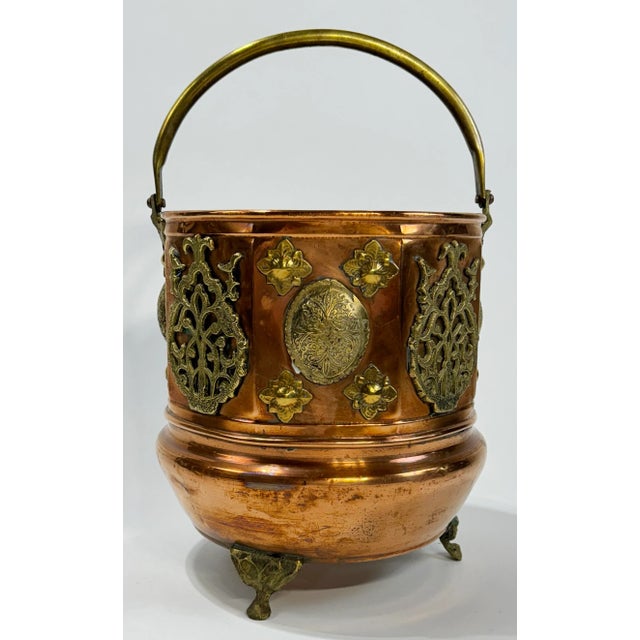Magnificent large antique Late 19th Century copper coal scuttle featuring pierced brass adornments and feet. Strong brass...