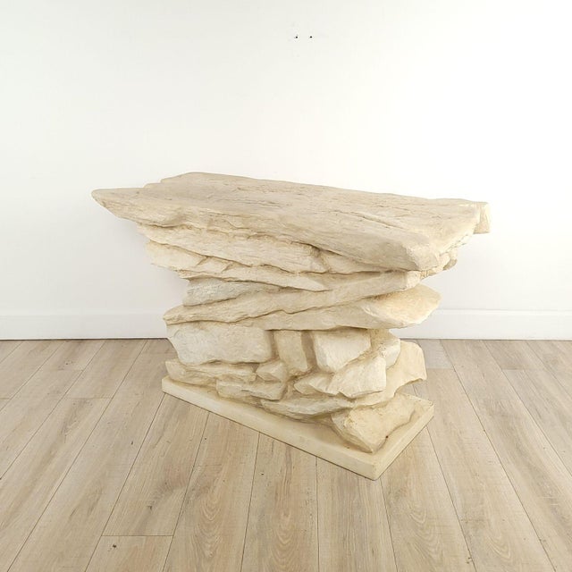 A faux stacked stone console by Sirmos, circa 1970, after Emilio Terry, first made for Chateau de Calvar in 1927. Two...