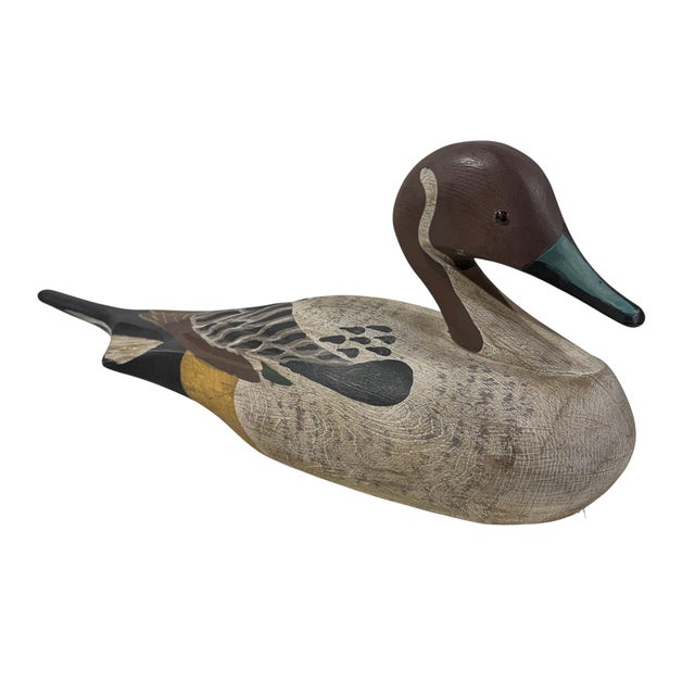 Vintage 20th century hand-carved and hand-painted solid wood Old Pintail duck decoy. This substantial piece measures 17"...