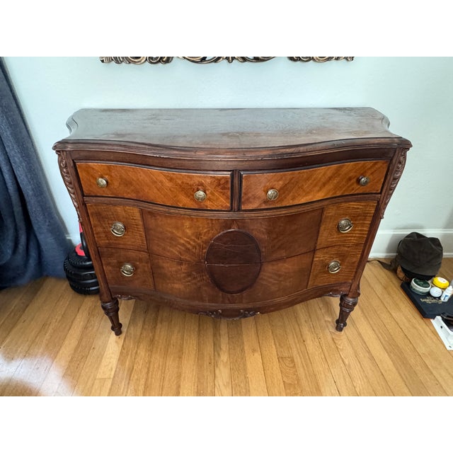 Elevate your interior with the timeless beauty of this Antique Burled Walnut and Inlaid Marquetry Dresser, a stunning...