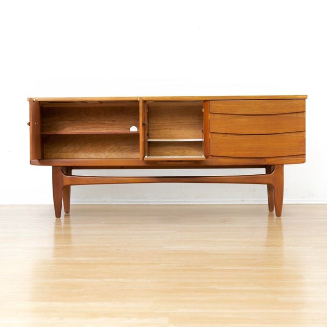 This vintage mid-century credenza was produced by Jentique Furniture during the 1960s. A wonderful modernist design and...