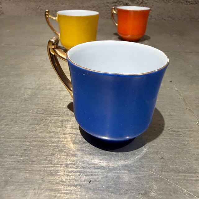 For your consideration, set of three (3) vintage porcelain espresso/demitasse cup. It features a rich, solid color block...