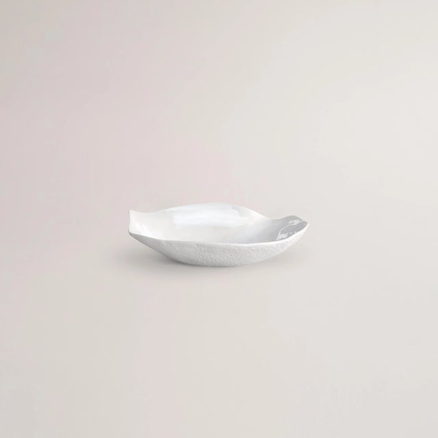 A sensual plate for a starter, dessert or side dish. • Small plate • 17cm x 18 cm x 4cm • Classic white • Textured bottom...