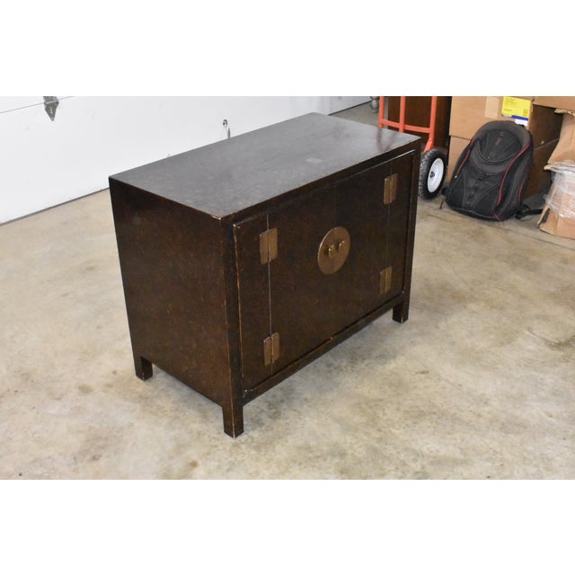 Astounding John Stuart golden faux tortoise shell credenza or cabinet. Brass hardware. Appears to be made of oak. Has 2...