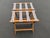 This pair of vintage folding luggage racks are composed of stained wood framing and stretchers and canvas strips. They...