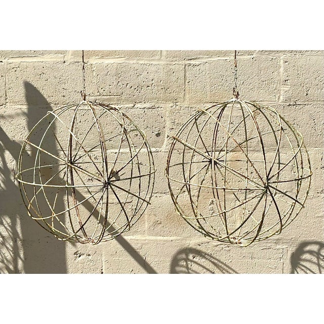 Add an effortlessly chic, sculptural touch to your home or garden with this striking pair of vintage distressed iron...