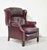 Rich in character and timeless in style, this vintage oxblood leather wingback chair embodies classic library elegance...