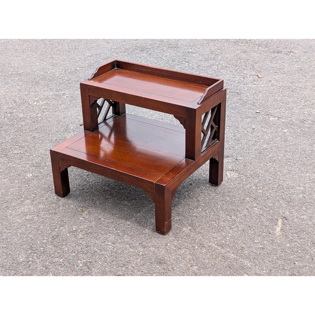 This exceptional vintage 1970s mahogany Chippendale style bed steps stool by Drexel Heritage seamlessly blends high-...