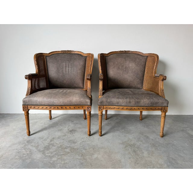 Elegant pair of vintage Louis XVI–style club chairs by Century Furniture, handcrafted with exquisite French neoclassical...