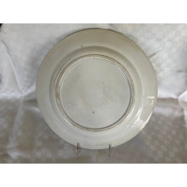 A 19th C transfer ware dinner plate in the Asiatic Pheasant design. The transfer ware is in cornflower blue and it s not...