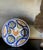 Large faience plate / bowl made in Spain in the early 20th century. Hand painted with the painters initials on the reverse.