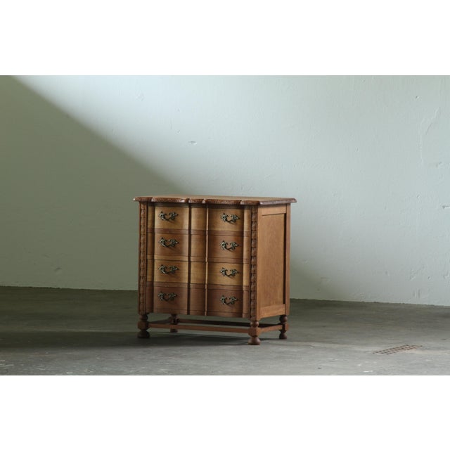 A small oak chest of drawers made in Denmark during the 1960s. This is a charming piece with a strong sense of Danish...