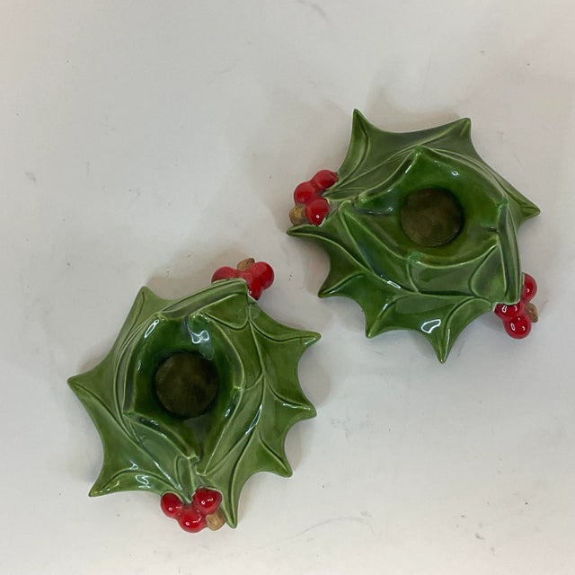 These are a pair of pretty Christmas Candle Holders. They are an American Folk Art ceramic piece. The Atlantic Mold is...
