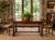 Versatile dining table from Century Furniture’s Coddington Square Collection, crafted in richly figured wood with a warm,...