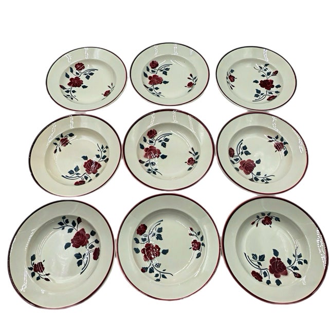 This set of nine charming soup plates comes from the Badonviller factory. It is the "Les Roses" pattern, dating from the...