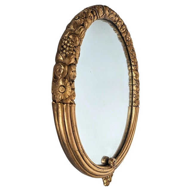 By LOUIS SUE AND ANDRE MARE. This rare Art Deco oval mirror made by Sue and Mare (Louis Sue, 1875-1968, and Andre Mare,...