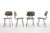 Great set of four dining chairs by Rudolf Wolf for Elsrijk. The frame is made of black lacquered metal and the chairs are...