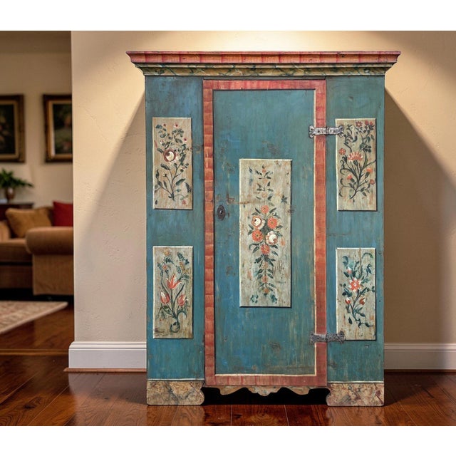 Tyrolean Antique Painted Wardrobe Hand‑painted antique wardrobe with floral panels, suitable for those looking for painted...
