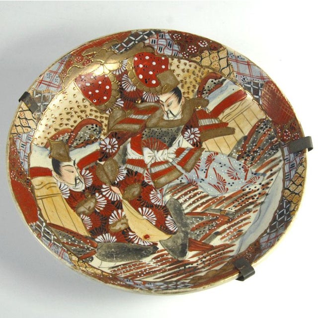 A beautiful, highly decorative Satsuma-style platter or bowl. Crafted from Japanese faience, the dense ornamentation is...