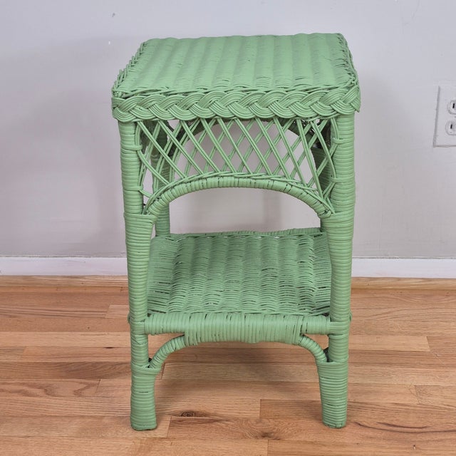 This is an adorable vintage wicker side table of diminutive scale. It would make a great side table or nightstand in a...