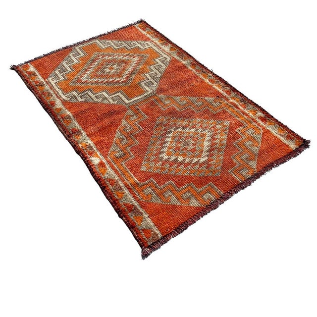 This Traditional Vintage Kurdish Herki Rug is a unique addition to your home décor collection. Measuring 140 X 92 cm, this...