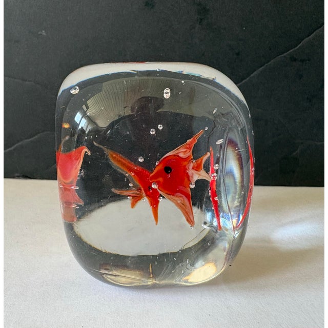 A striking mid-century Murano-style aquarium sculpture featuring hand-formed scarlet angelfish floating within a...