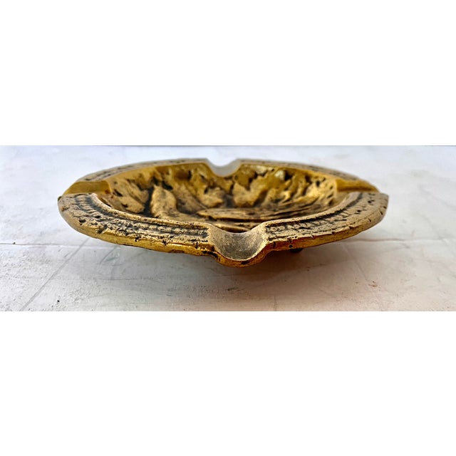 Mid-century treasure. Brass ashtray with embossed bird design. The ashtray measures 6 x 4 3/4 inches. 4 GOOD donates all...